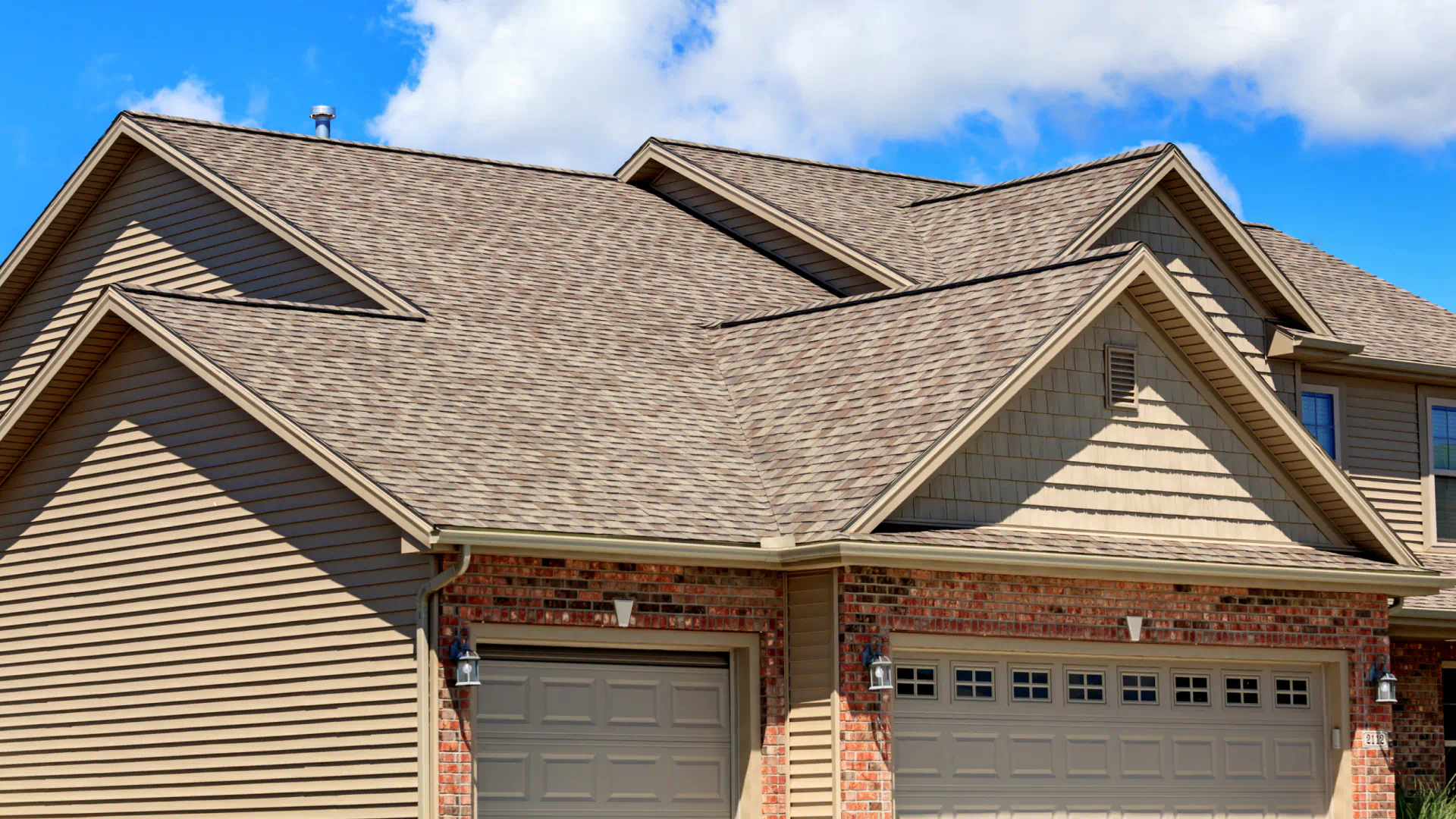 new asphalt roofing of residential house